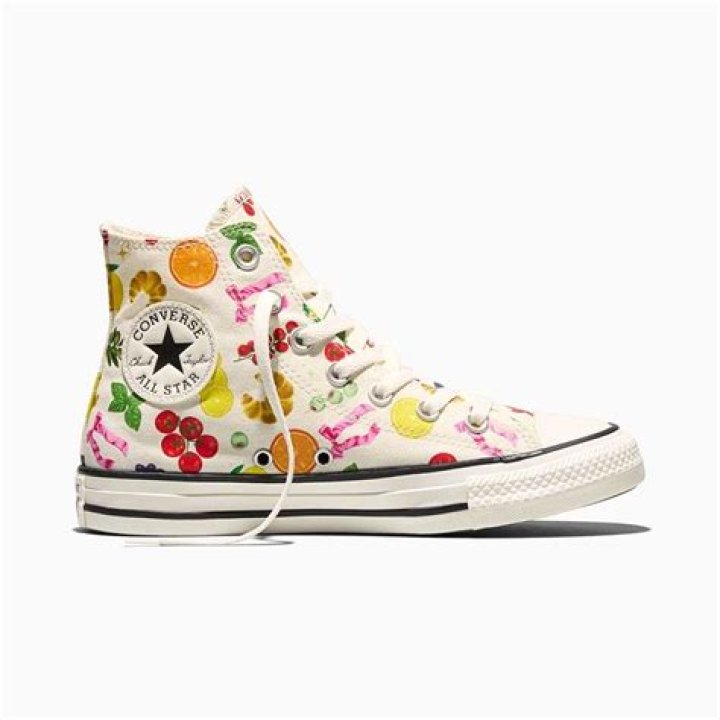 Comfortable white converse with colored laces festival attendee